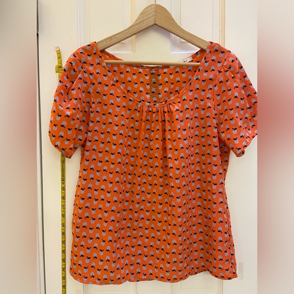 Adorable peach print blouse from Miami in orange